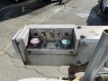 Control panel of a 2008 Ford Econoline with buttons for action and power indicators in different colors