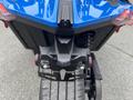 Rear view of a blue 2020 Polaris Slingshot showcasing its distinctive tail lights and tire detail