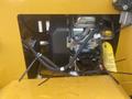 A close-up view of the engine compartment of a 2024 AGT KRW 23 Mini loader showing various components including hoses and electrical connections