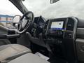 Interior view of a 2020 Ford F-350 Super Duty with a steering wheel digital display and a touchscreen infotainment system