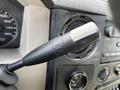 A close-up of the tow/haul switch located on the dashboard of a 2008 Ford F-550
