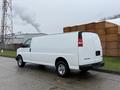 A white 2014 GMC Savana van parked with a plain exterior and no visible markings or logos on the side