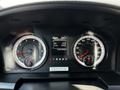 The dashboard of a 2016 RAM 2500 displaying gauges for speed, RPM, and engine hours along with a digital screen showing temperature and drive metrics