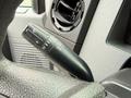A close-up view of the control stalk for windshield wipers in a 2016 Ford F-550 Super Duty featuring various settings and indicators