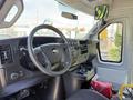 Interior view of a 2019 Chevrolet Express showing the dashboard steering wheel and control panel