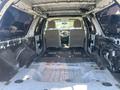 Interior of a 2013 Ford Expedition showing a stripped-down cargo area with no seats and exposed flooring and panels