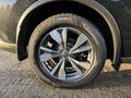 Close-up of a 2021 Nissan Murano wheel featuring a multi-spoke alloy design and a high-traction tire