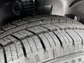 Close-up of a tire with detailed tread pattern mounted on a 2023 Mercedes-Benz Sprinter vehicle