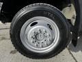 A close-up of a silver wheel with a Continental tire branded as HDR on a 2011 Ford F-450 SD