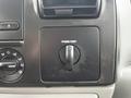 Close-up of the dashboard controls in a 2007 Ford F-550 featuring a dial for power point along with other buttons and knobs