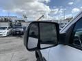 2021 RAM 1500 side mirror reflecting clouds and surrounding vehicles