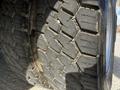 A close-up view of a textured tire of a 2018 Ford F-550 showing detailed tread patterns and some dirt accumulation