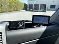A 2017 Mercedes-Benz Sprinter with a dashboard featuring a radio and a Garmin GPS device