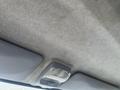The ceiling interior of a 2008 Mitsubishi Fuso FE180 featuring a light fixture and gray fabric upholstery