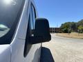 A 2019 Mercedes-Benz Sprinter van showing the side mirror and part of the vehicle from a low angle perspective