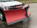 A 2021 Ford F600 pickup truck with a large red snow plow attached to the front