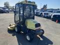 A yellow 2010 Kubota F3680 compact lawn mower with a cab and a rear-mounted mower deck