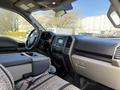 Interior view of a 2018 Ford F-150 showing the dashboard center console and driver's seat