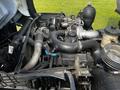 Engine compartment of a 2009 Ford LCF 550 showing a turbocharged engine with various hoses and components prominently displayed