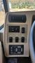 Control panel of a 2007 Winnebago Adventure featuring buttons for battery boost, power levels, and computer leveling system