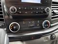 The dashboard controls of a 2023 Ford Transit featuring audio and climate control buttons