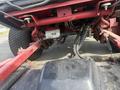 A 2013 Toro Grounds Master 5910 showcasing its undercarriage with visible hydraulic lines and components