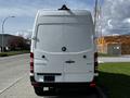 A white 2017 Mercedes-Benz Sprinter van viewed from the rear with the brand logo and model name visible on the back door