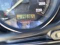 Close-up of a speedometer on a 2004 Harley-Davidson Flhtcui displaying a mileage reading of 146365 km