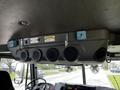 The interior of a 2009 Spartan Gladiator showing a control panel with multiple outlets and hooks for equipment
