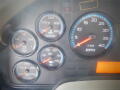 Dashboard panel of a 2016 International WorkStar 7500 displaying gauges for water temperature oil pressure RPM and transmission indicators