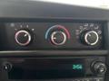 Climate control knobs and digital clock display in a 2020 Chevrolet Express van interior