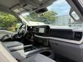 Interior view of a 2023 Ford F-550 showing the dashboard seats and central console