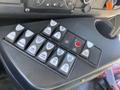 A control panel featuring various buttons for lighting and other functions inside a 2020 Chevrolet Express vehicle