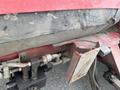 Close-up of a 2012 Toro Groundsmaster 5910 with visible wear on the hull and mechanical components including hoses and metal parts