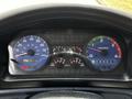 Dashboard of a 2006 Hino 268 displaying speed, RPM, fuel level, and warning lights with various gauges and indicators