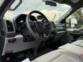 Interior view of a 2017 Ford F-350 SD showing the steering wheel dashboard and seats