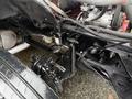 Close-up view of the chassis and suspension system of a 2011 Ford F-650 featuring components like the axle and various connecting parts