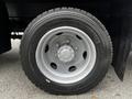 Close-up of a Michelin tire mounted on a 2014 Hino 195 truck with a detailed rim and tread visible