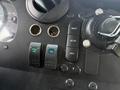 Dashboard controls of a 2018 Ford E-450 featuring buttons for cargo dome fans reset setup and info