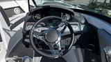 Steering wheel and dashboard of a 2023 Mercury Monterey with digital displays and chrome accents