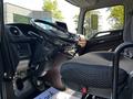 Interior view of a 2021 Hino 338 truck featuring the driver's seat steering wheel dashboard and controls