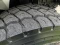 Close-up of a rugged tire tread from a 2008 International 7500 showcasing deep grooves and textures designed for grip and traction on various surfaces