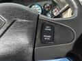 Close-up of the steering wheel of a 2008 International 7500 with a black leather cover and a cruise control button labeled Set Cruise Resume Accel