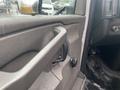 Interior door handle of a 2017 Chevrolet Express with water droplets on the surface