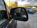 2008 Ford F-250 SD side mirror reflecting the interior of the vehicle and displaying a clear view of the driver's seat and steering wheel