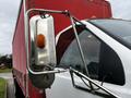 A 2008 Ford F-750 truck featuring a chrome side mirror with an orange indicator light