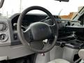 Interior view of a 2009 Ford Econoline showing the steering wheel dashboard and control panel