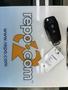 A 2017 Ford F-250 SD key fob resting on a surface with a tag attached featuring a barcode and number