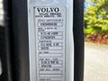 A 2005 Volvo VND 122 truck with visible vehicle identification information including engine and transmission details
