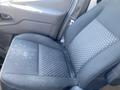 A black fabric seat from a 2022 Ford Transit with a checkered pattern on one side and smooth fabric on the other